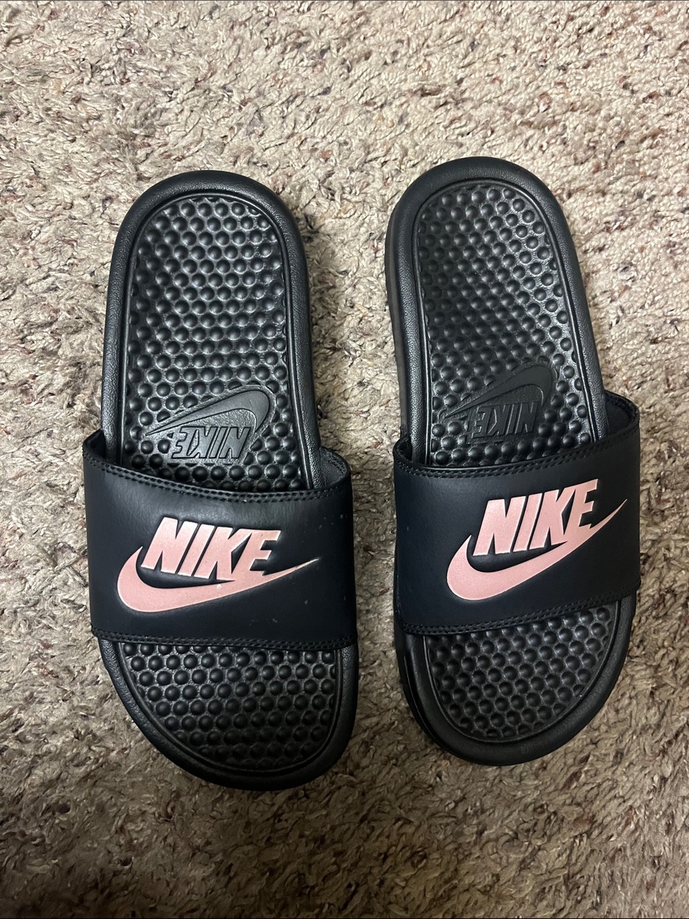 Nike women’s black slides with pink swoosh